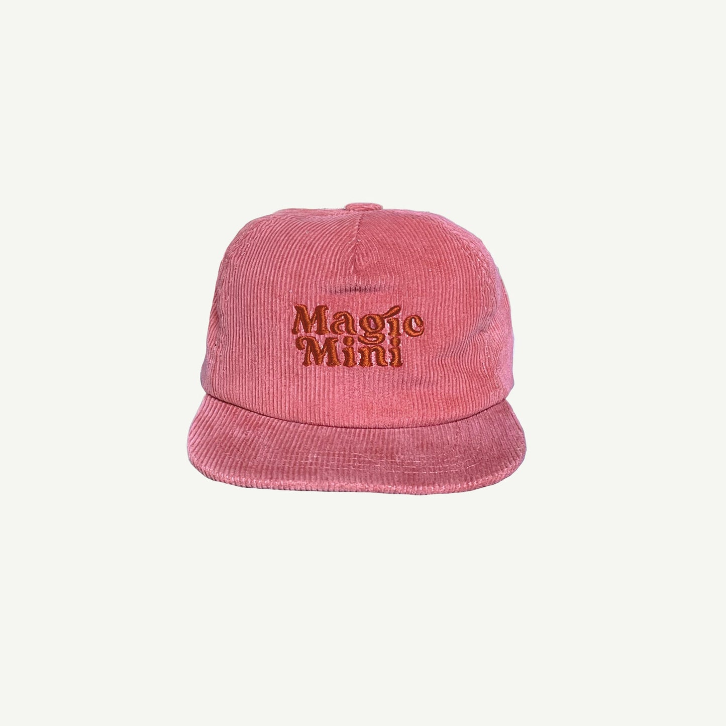 Kids Pink corduroy cap with Magic Mini embroidered on center front in darker tone of pink.