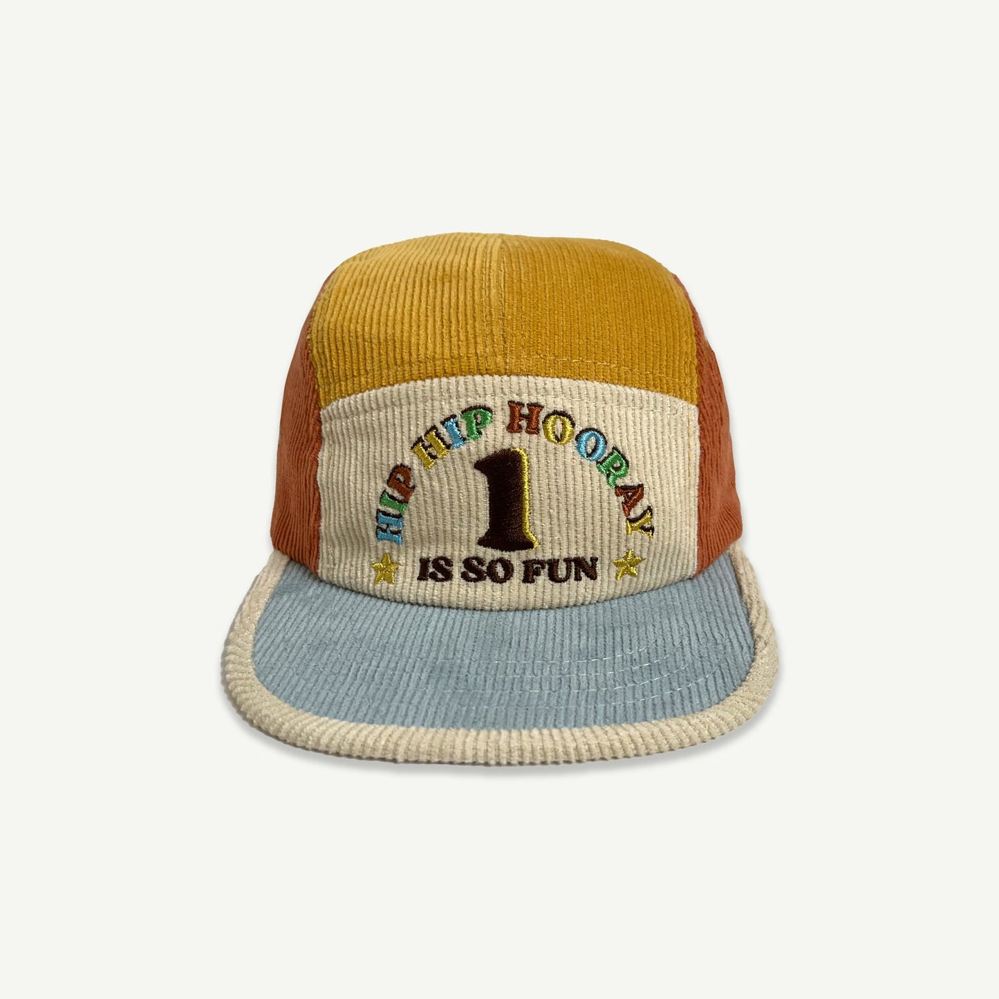 1st Birthday Cord 5 Paneled Cap. Colour blocked in blue, orange, natural and yellow . Front of cap is natural with HIP HIP HOORAY 1 IS SO FUN embroidered in multicolored thread. Blue peak with contrast Natural bind. 