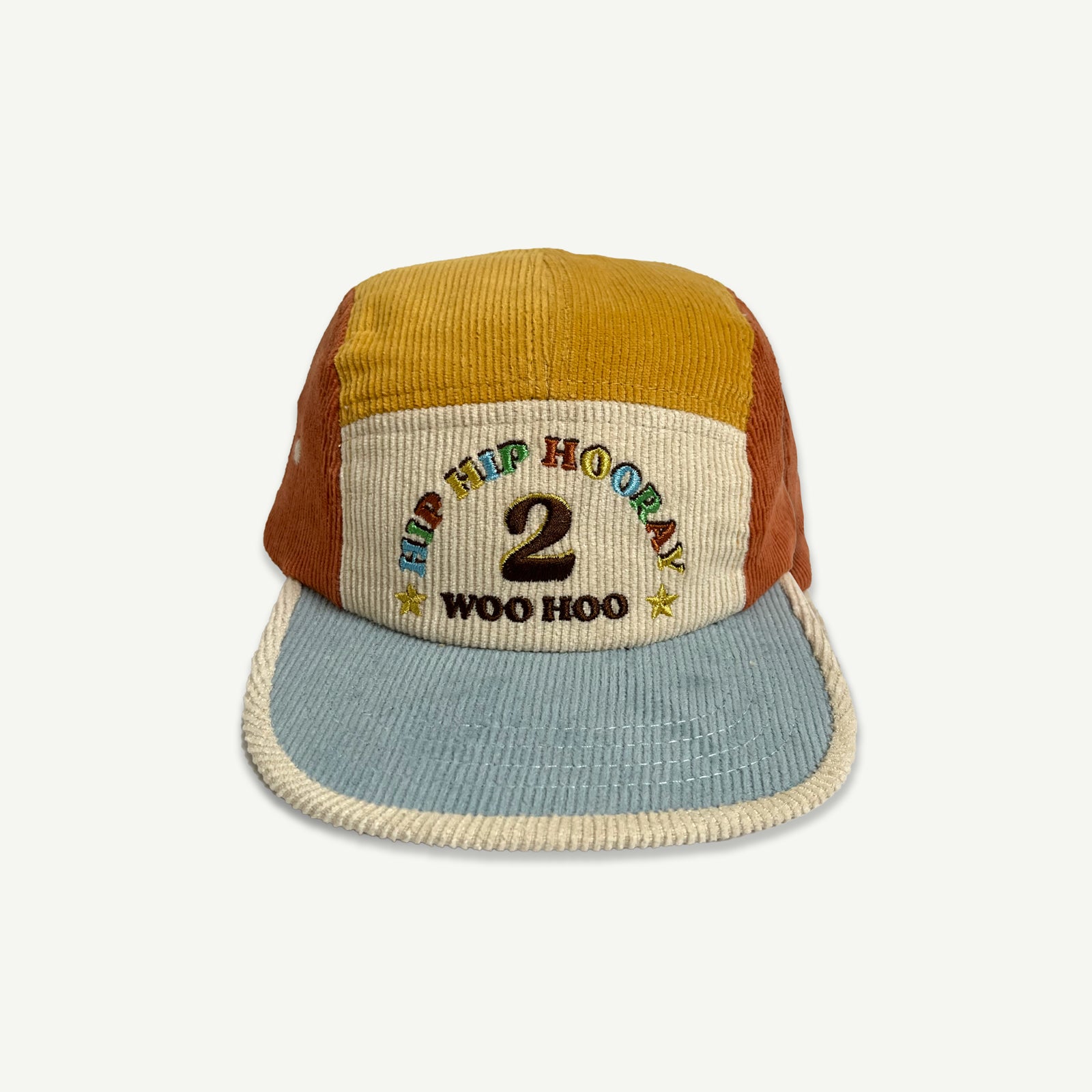 2nd Birthday Cord 5 Panelled Cap. Colour blocked in blue, orange, natural and yellow . Front of cap is natural with HIP HIP HOORAY 2 Woo Hoo embroidered in multicolored thread. Blue peak with contrast Natural bind. 