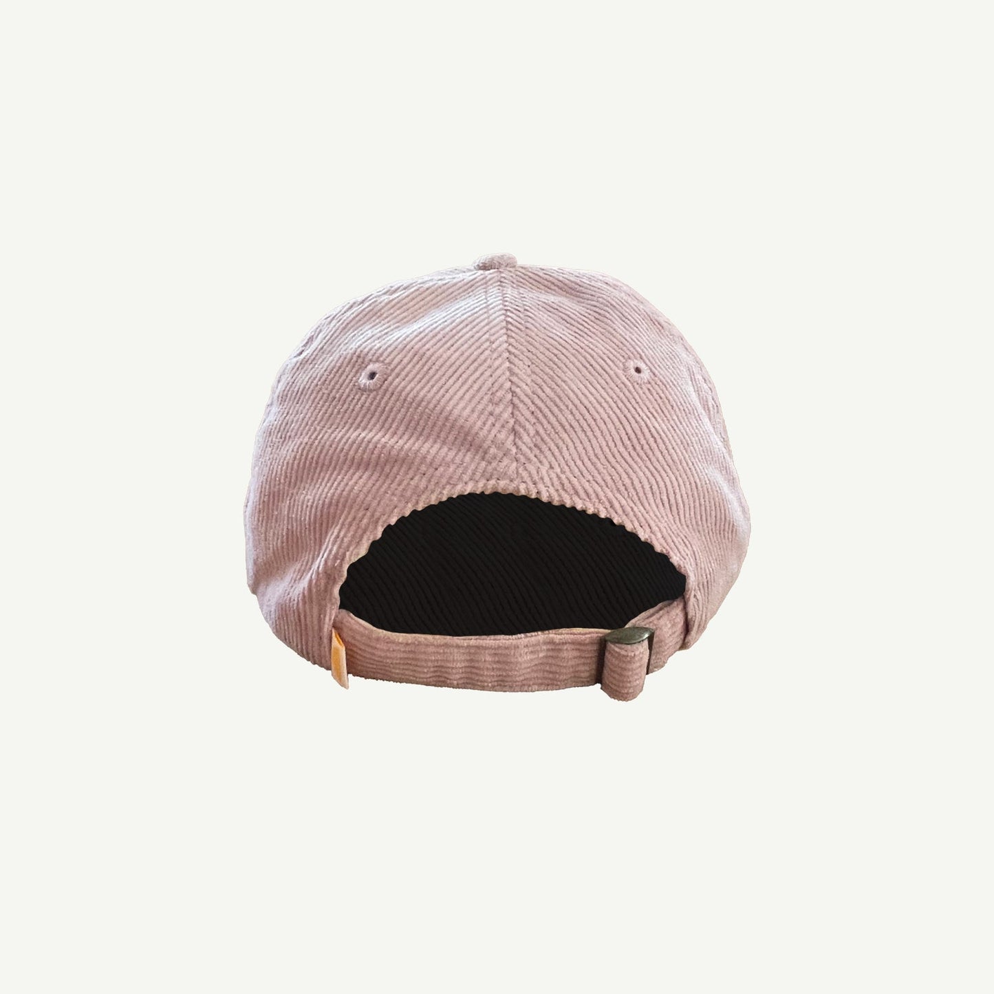 back view of pink corduroy cap with  adjuster strap with metal fitting.