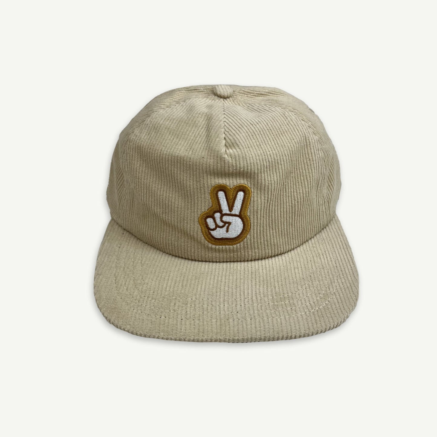 Ecru cord pinch front flat Cap with V-Sign representing peace embroidered in white, with thin brown boarder and larger boarder in golden yellow